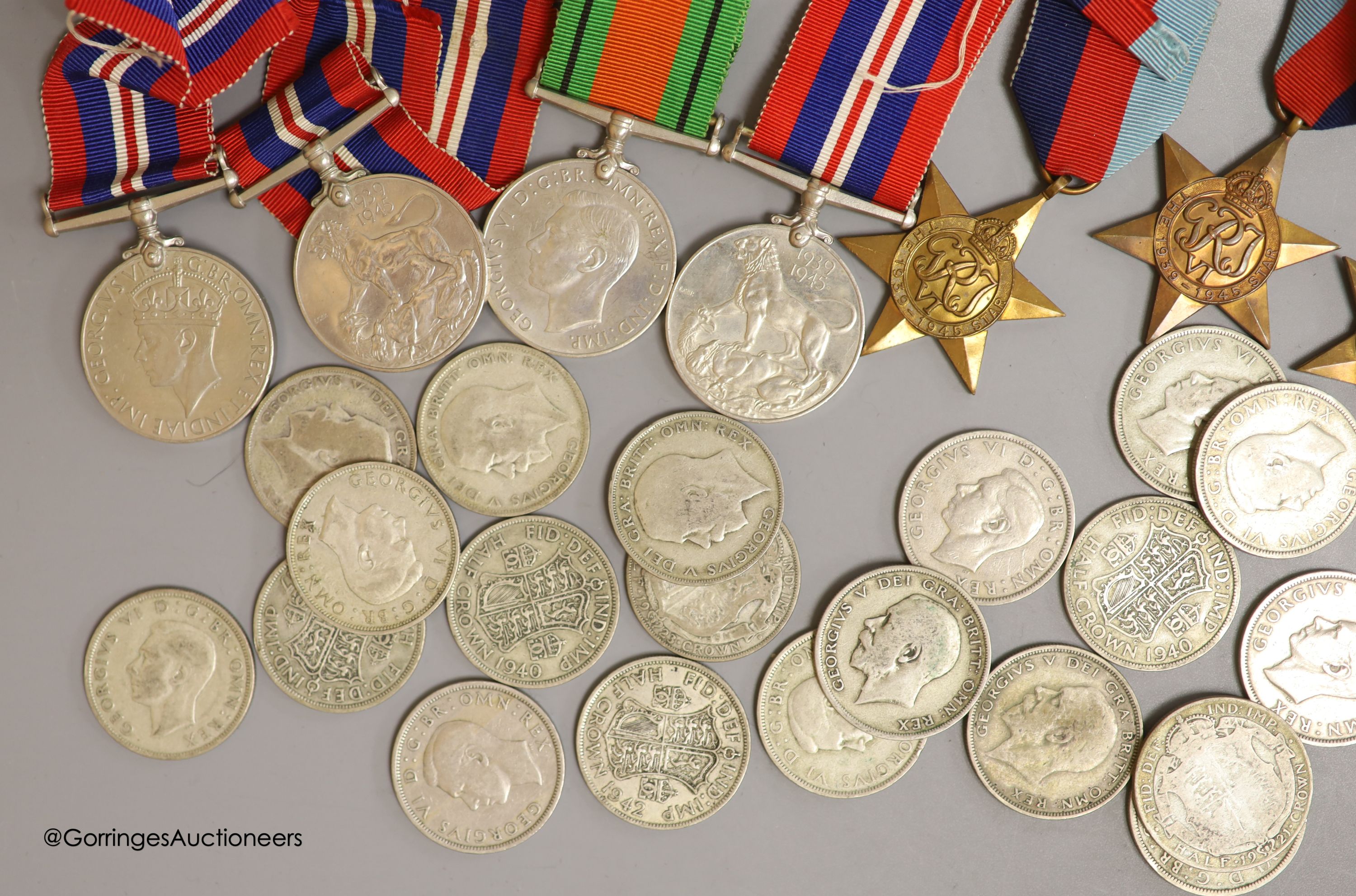 A quantity of coins and WWII medals
